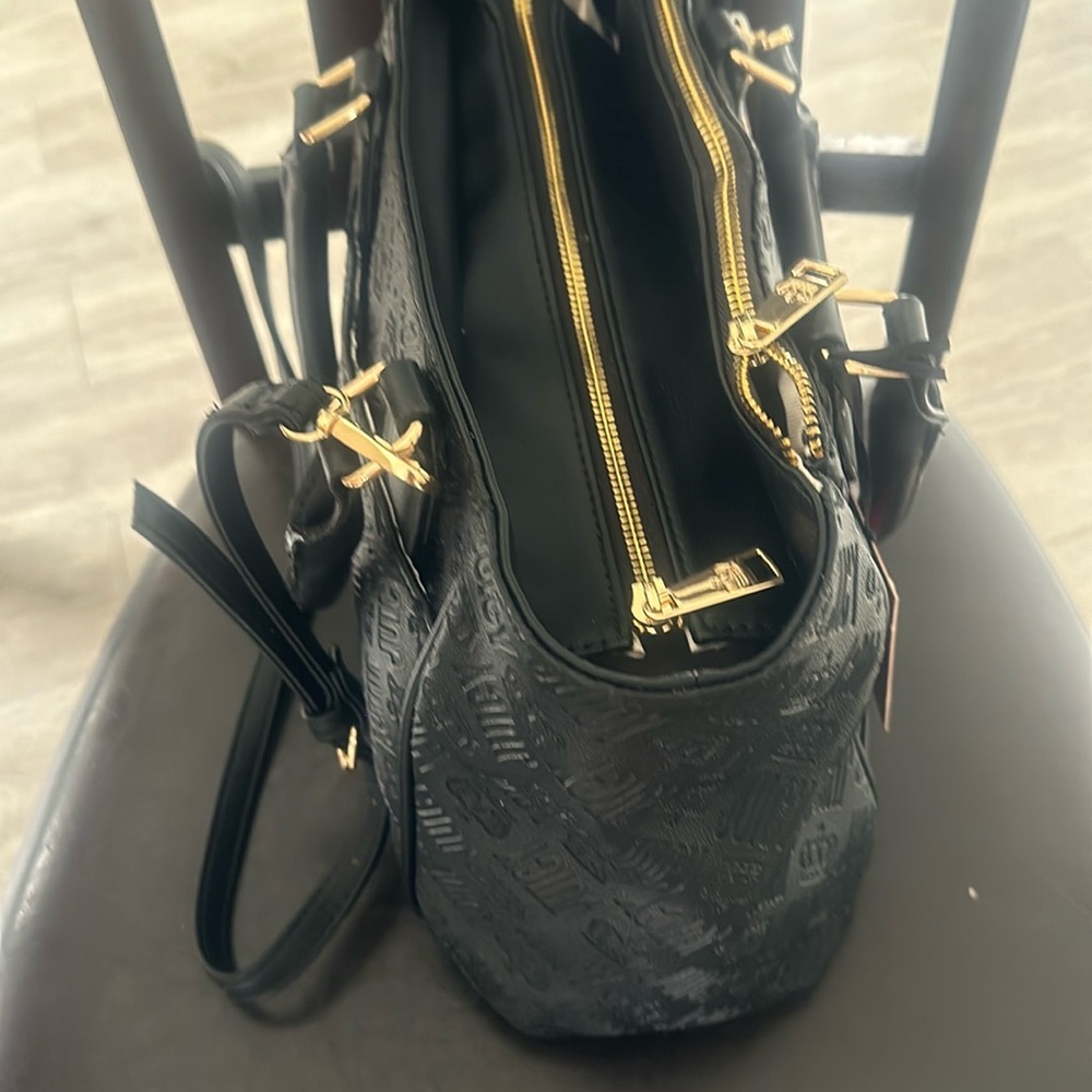 It a black juicy couture brand new with tags from JCPenney